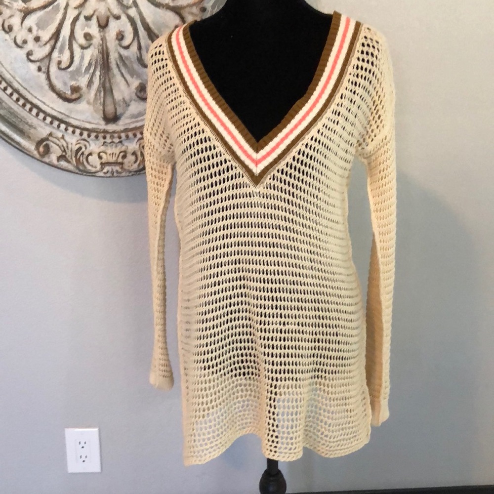 Cream colored, long sleeved,V-neck sweater
